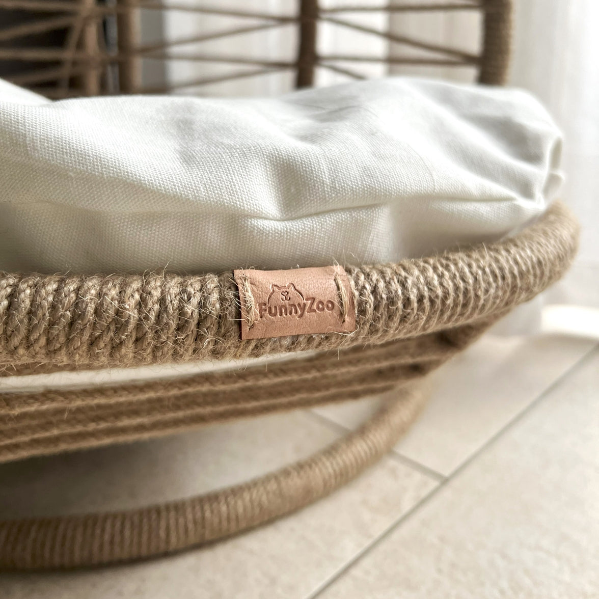 Space-saving pet bed with open front and ergonomic shape