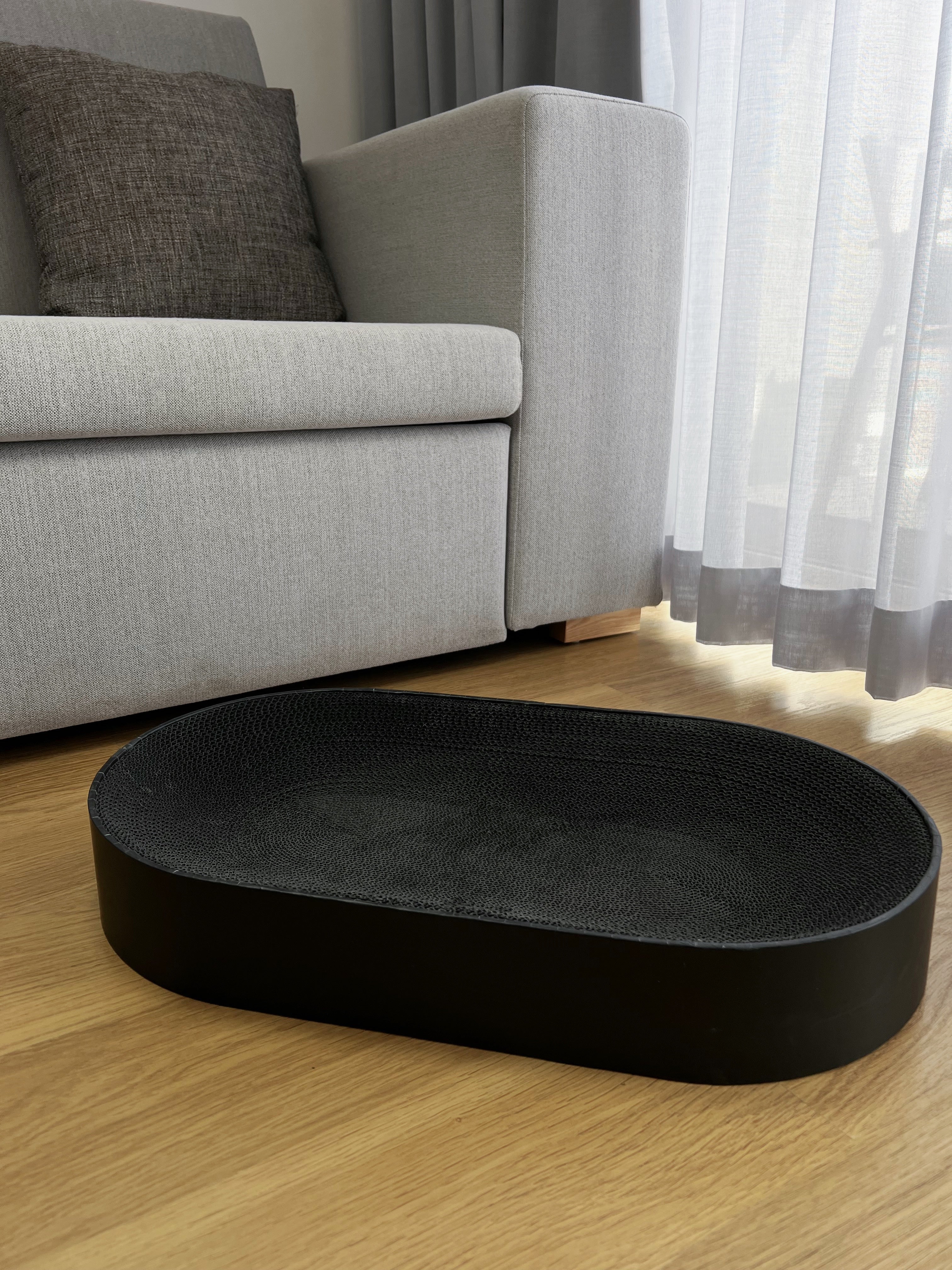 Oval cardboard cat scratcher for large cats